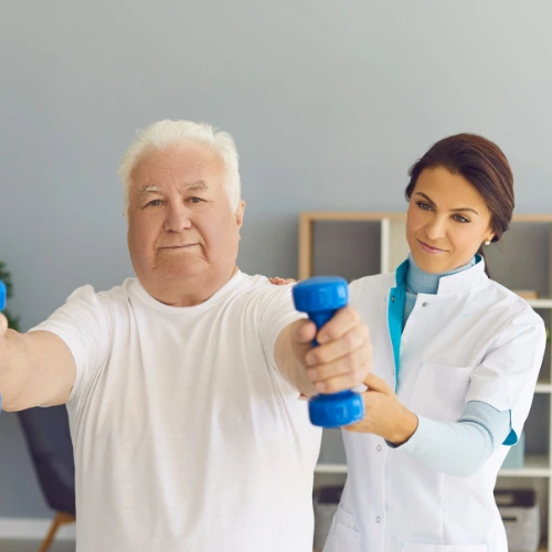 older man exercising in a nursing home
