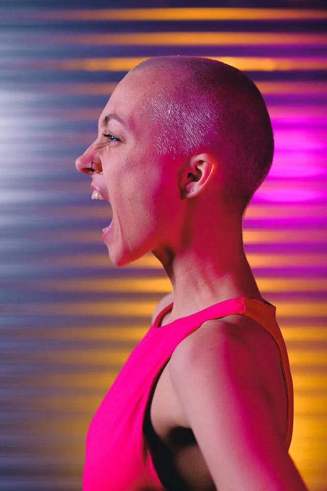 bald woman shouting