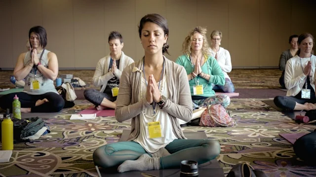 women meditating in a group
